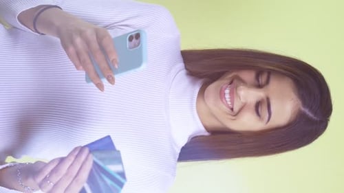 Woman Enjoys Online Shopping With Phone and Card