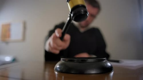 Judge's Hand with Wooden Judge Gavel Close Up Shot of Judge Gavel Slow Motion View