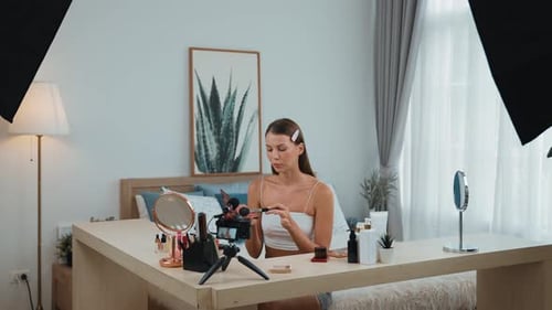 Stylish Woman Creates Beauty Content in Bedroom Studio