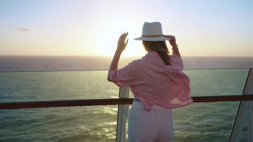 Woman Enjoys Ocean Cruise at Sunset