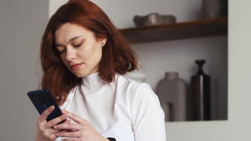 Woman Using Mobile Phone Indoors, Close Up