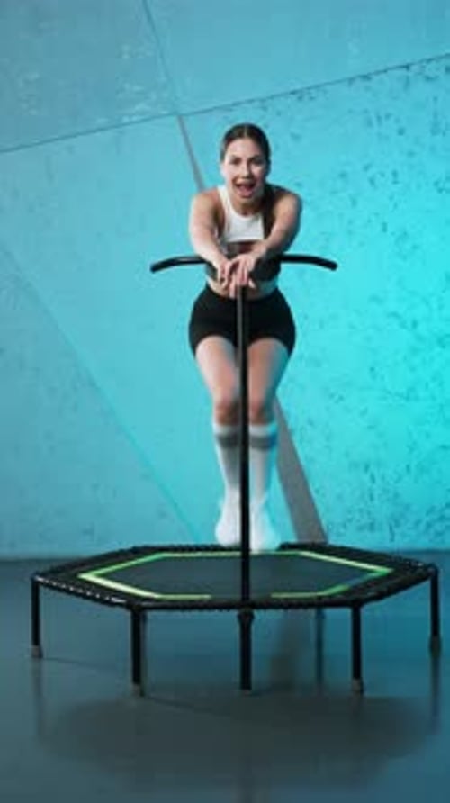 Woman Exercising on a Rebounding Mini Trampoline