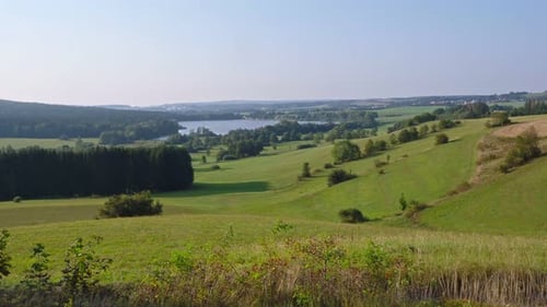 Panoramic view of pond named River and surrounding meadows and woods