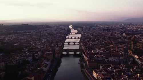Forward pushing drone shot around Florence, Italy. Showcasing architecture of the city and the Arno