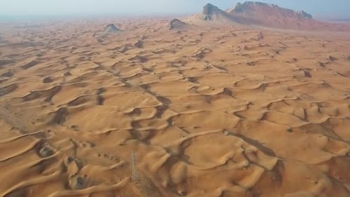 Breathtaking Cinematic Shot of a Remote Desert with Smooth Sand Waves
