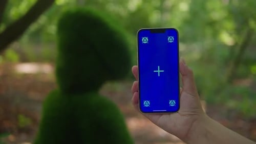 Young Woman Holding Phone Chroma Key Screen in the Green Park Closeup Girl with Green Screen on