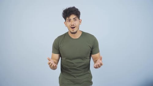 Young Man Reacts with Varied Facial Expressions