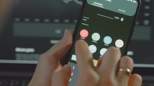 Using Budgeting App on Mobile Phone Close Up