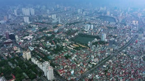 Drone, outdoor and city with sunshine, landscape and top view with urban town