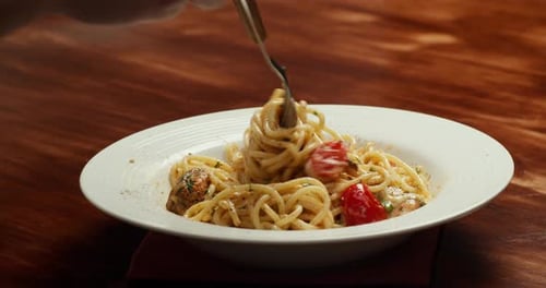Plate of Spaghetti Being Enjoyed with Fork