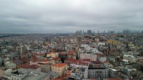 the Galata Tower, business part of the city in the background fly backwards