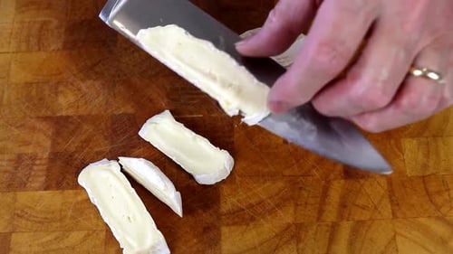 Slicing Camembert Cheese With a Knife