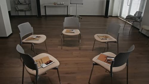 Support Group Therapy Room with Chairs in Circle and Materials