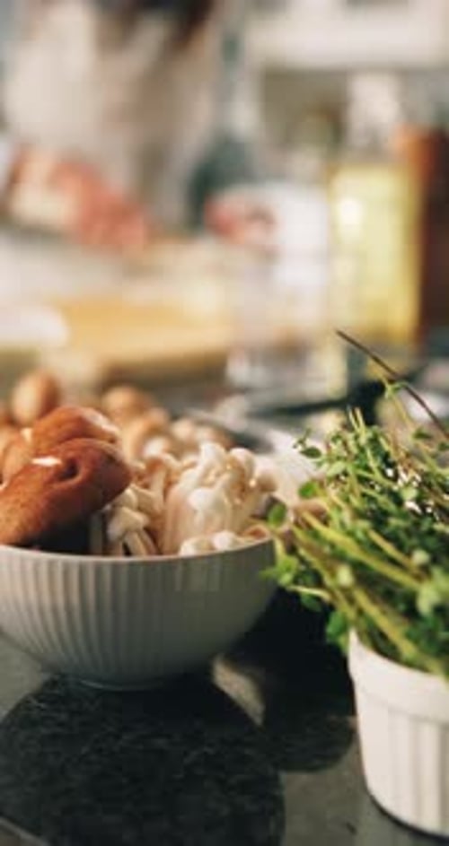 Preparing Mushrooms and Herbs in Bright Kitchen