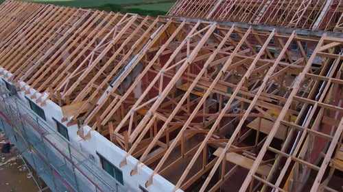 Aerial View of New Home Under Construction With Truss Roof