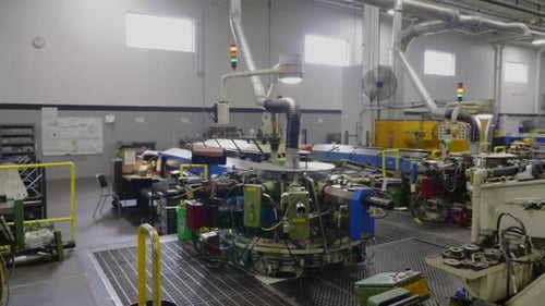 rows of rotary transfer machines in a factory setting