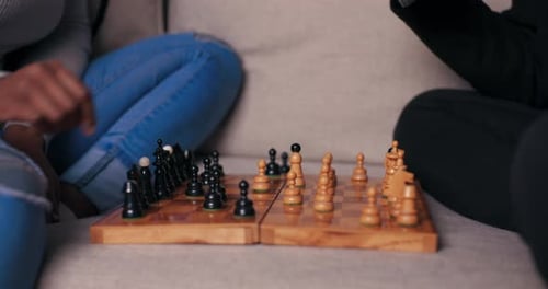 Friends Enjoying a Game of Chess at Home