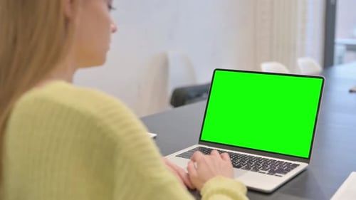 Woman Working on Laptop with Green Screen Chroma Key