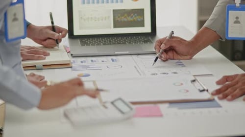 Close up of business hands are working and brainstorming on paperworks.