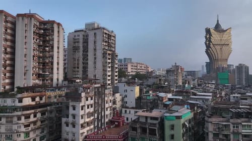 Old Residential Buildings On The Background Of Modern Macau