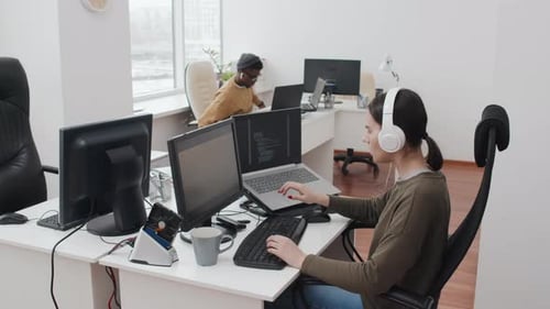 Young People Working In Open Plan Office