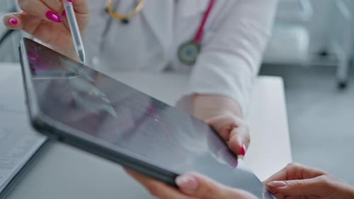 Patient Reviewing Healthcare Data on Tablet Screen Closeup Modern Technology