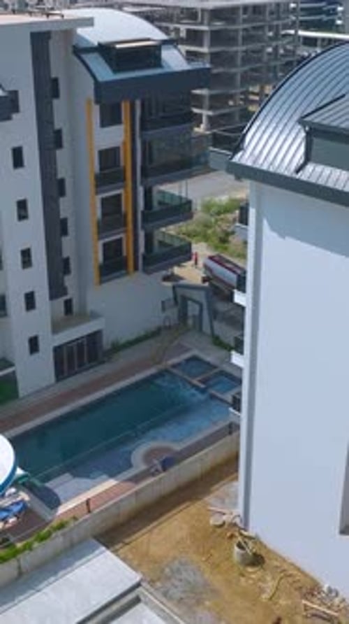 Vertical Video Clear Water Filling a Pool at a Modern Residential House