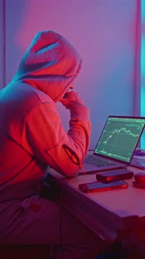 Investor Analyzing Data Person Concentrates On Stock Market Information During Busy Evening Hours