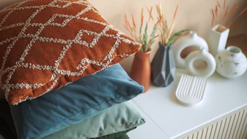 Close up of colorful decorative pillows on table