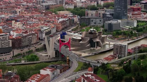 Stunning Aerial View Flying Over the City of Bilbao Spain Revealing Iconic Guggenheim Museum and