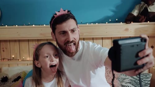 Bearded Father and Daughter Posing for Fun Selfie