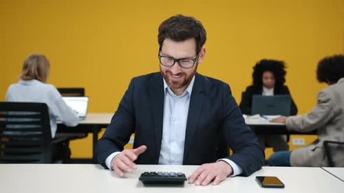 Closeup Shot of Caucasian Corporate Worker Smiling and Looking Joyous