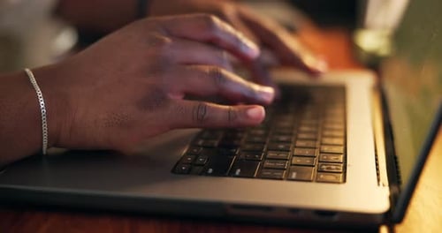 Close Up of Hands Typing on Laptop Keyboard