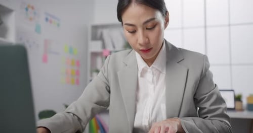 businesswoman sitting on desk with laptop computer work online marketing at modern office.
