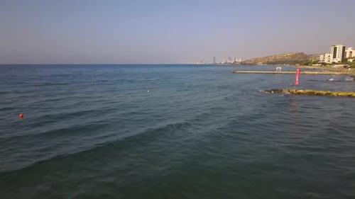 Summer sea city. Flight over the city, sea and buildings.
