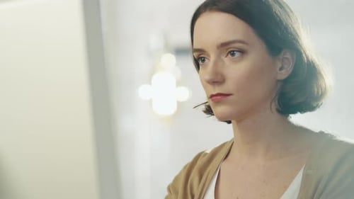 Beautiful Creative Woman Sits at Her Office Working On a Computer.