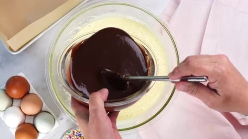 Adding Chocolate Sauce to Cake Batter, Overhead View