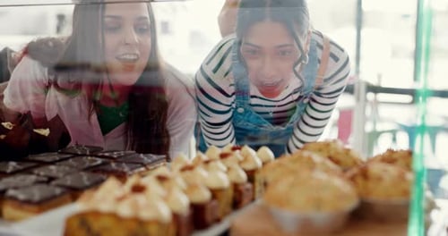 Bakery, shopping and women looking at dessert for a decision, discussion or buying for lunch