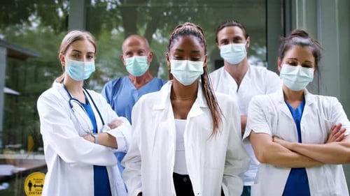 Team of Doctors in Masks at Hospital
