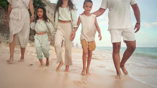 Happy Family of Adult People with Children Walking at Sea Water of Ocean Beach