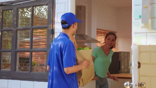 Woman Receives Grocery Delivery at Front Door