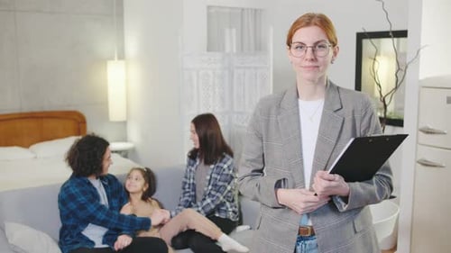 Family Talking at Home With Redhead Woman