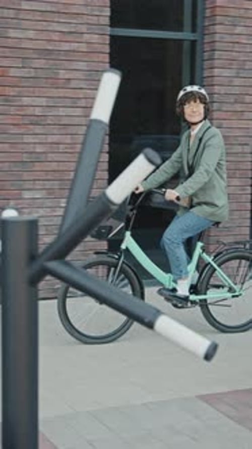 Businesswoman Wearing Helmet Riding Bicycle