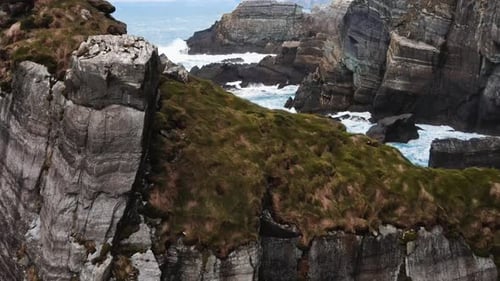 Drone Flying Through Island Cliffs in Ireland Aerial View Near of Mizen Head