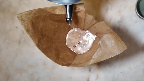 Water Pouring Over Coffee Grounds in Filter