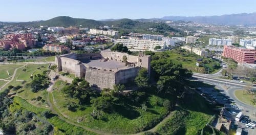 Aerial view of Fuengirola city, in southern Spain. There are various types of buildings to be seen.
