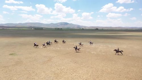 Horses And Men In Javelin Game With Aerial View