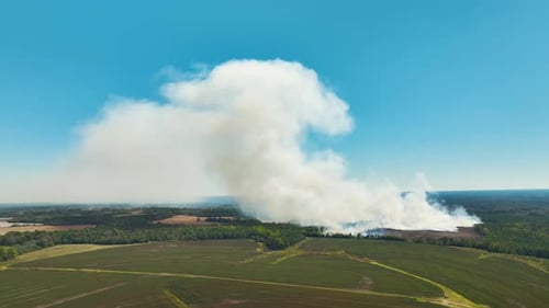 View From Above of Dense Smoke From Woodland and Field on Fire Rising Up Polluting Air