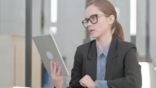 Young Adult Woman on Video Call with Tablet