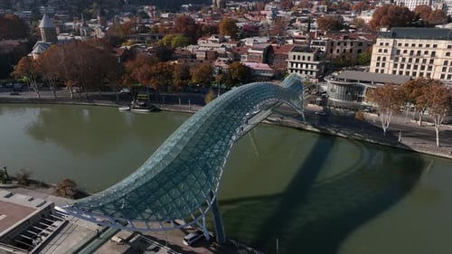 Aerial view of Tbilisi city central park and Bridge of Peace. Beautiful cityscape of old Tbilisi
